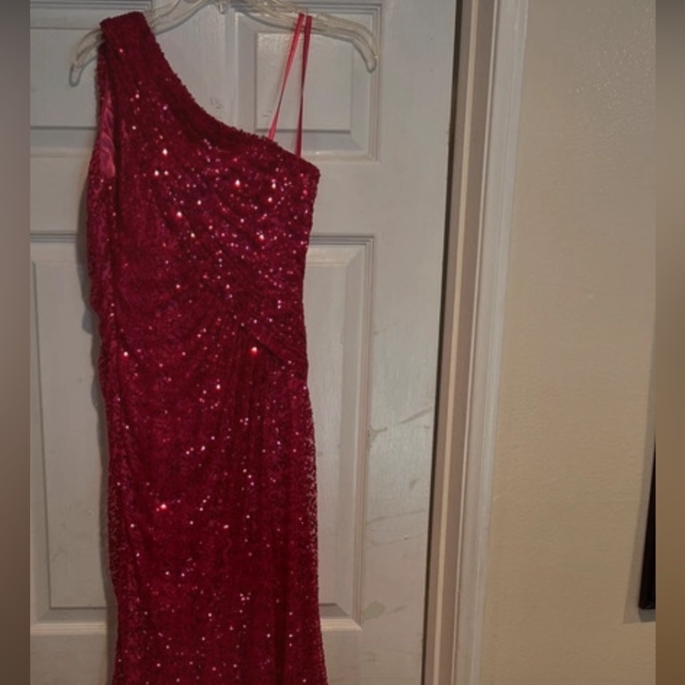 Purchased from Neman Marcus brand La femme sequins evening gown